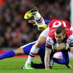arsenal-s-jack-wilshere-r-and-aaron-ramsey-hidden-vie-with-everton-s-steven-pienaar-in-london-on-april-16-2013-2