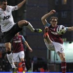 manchester-united-s-robin-van-persie-l-vies-with-west-ham-united-s-joey-o-brien-r-in-east-london-on-april-17-2013-2